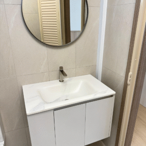 Custom-design wall-mounted basin cabinet with grey swing doors and white basin top, front view